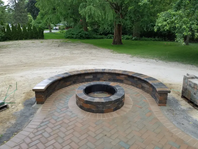 Curved seating wall and fire pit