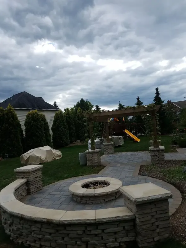 Pergola, fire pit and seating wall