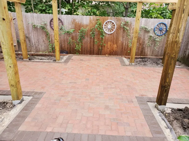 Paver patio under a cedar pergola