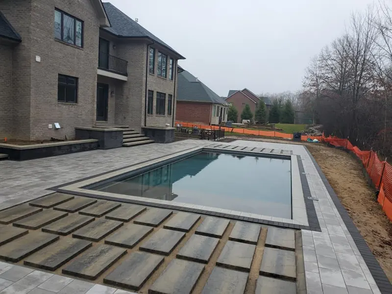 Modern pool surround with large-format pavers